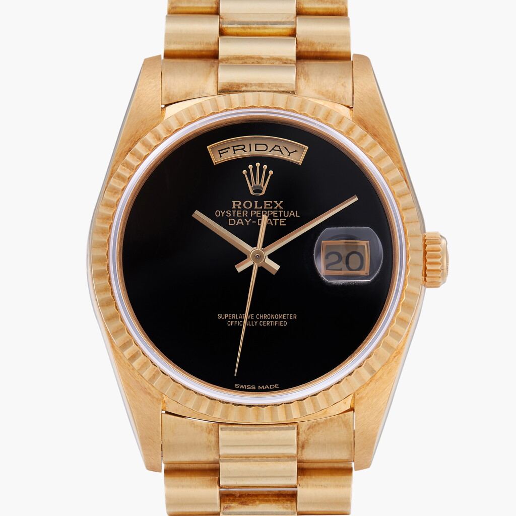 View full screen - View 1 of Lot 56. Day-Date, Reference 18238 | A yellow gold wristwatch with day, date, bracelet and onyx dial | Circa 1990.