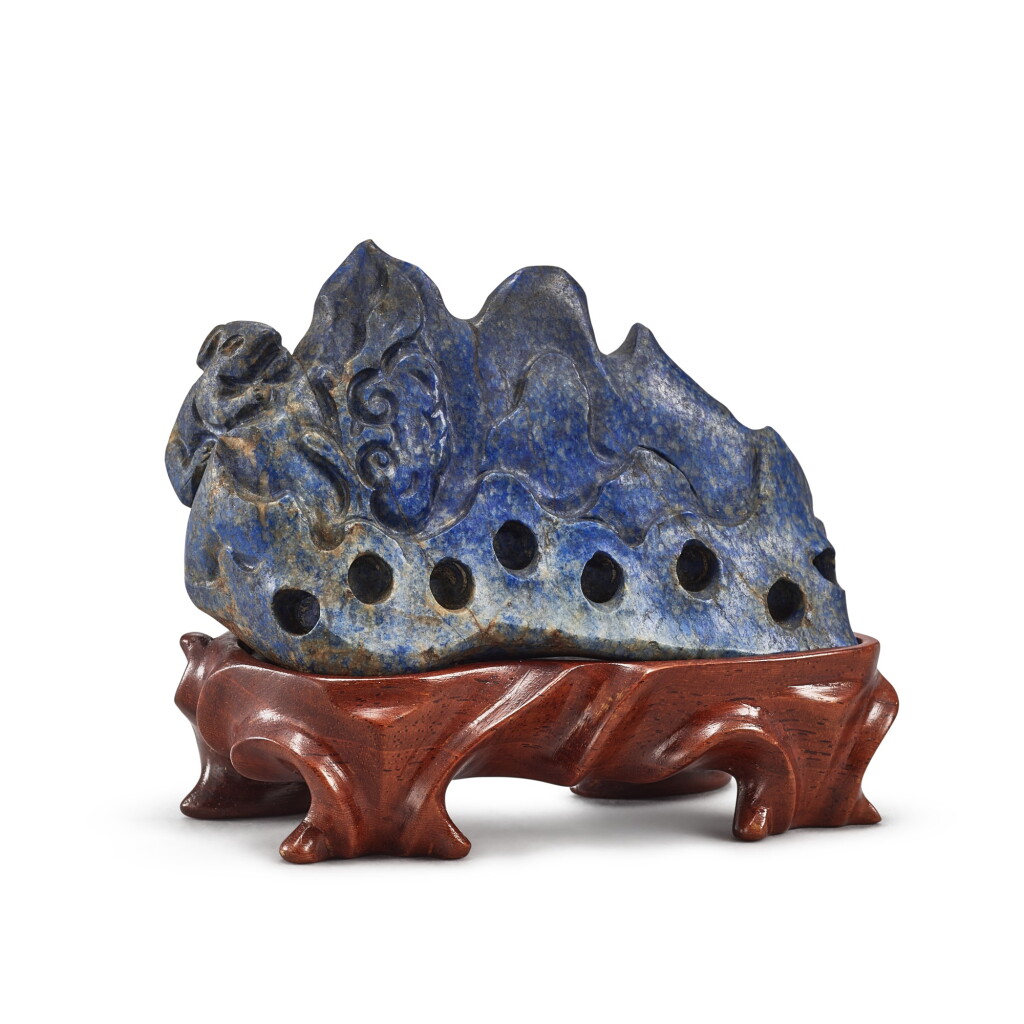 View full screen - View 1 of Lot 3007. A carved lapis lazuli 'rabbit and lingzhi' boulder, Qing dynasty, 19th century 清十九世紀 青金石瑞兔靈芝圖山子.