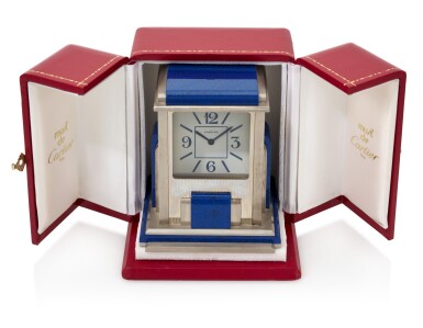 View full screen - View 1 of Lot 54. MYSTERY PRISM DESK TIMEPIECE SILVER-PLATED AND SIMILI-LAPIS LAZULI CLOCK (OROLOGIO DA TAVOLO IN SIMIL-LAPISLAZZULI E PLACCATO ARGENTO) CIRCA 1990 | CARTIER .