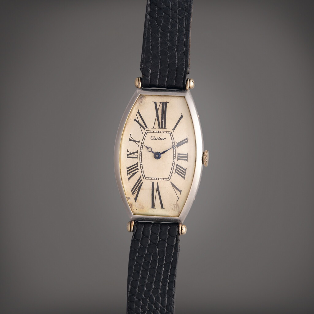 View full screen - View 1 of Lot 41. Tonneau | An early platinum and gold tonneau shaped wristwatch, Owned by Al Jolson and Gifted to Dr. Leo Winter, Circa 1920.