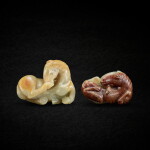 Two celadon and russet jade recumbent horses, Ming dynasty 明 青玉臥馬兩件
