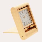 A gilt metal folding travel clock | Circa 1960