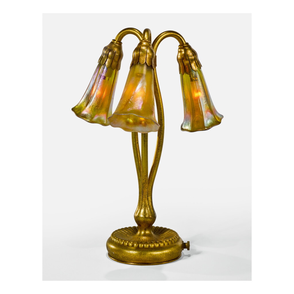 View full screen - View 1 of Lot 63. TIFFANY STUDIOS | THREE-LIGHT "LILY" TABLE LAMP.