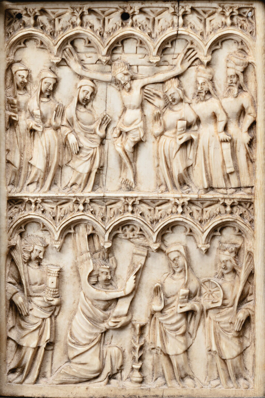 View full screen - View 1 of Lot 1. FRENCH, MOSAN OR RHENISH, CIRCA 1360-80 | AN IVORY WRITING TABLET WITH THE CRUCIFIXION AND THE ANNUNCIATION.