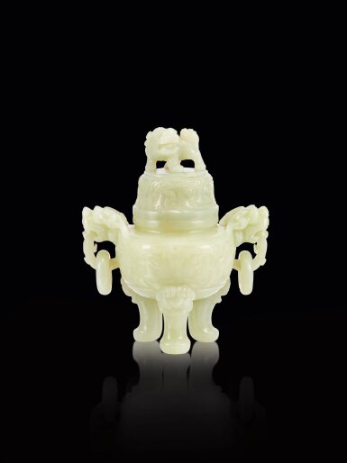 View full screen - View 1 of Lot 430. A white jade 'taotie' incense burner and cover, Qing dynasty, 19th century 清十九世紀 白玉獸面紋獸首銜環耳三足蓋爐.