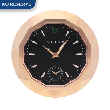 View full screen - View 1 of Lot 436. PINK GOLD COATED STAINLESS STEEL DUAL TIME ZONE DESK CLOCK CIRCA 2012.