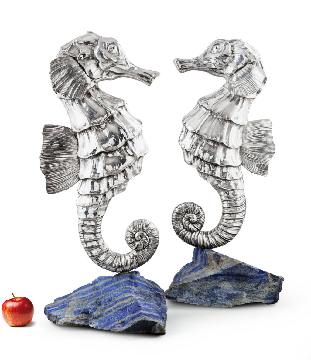 View full screen - View 1 of Lot 11. Two large silver sea-horses, Mario Buccellati, Milan, circa 1960, on lapis bases | Deux grands hippocampes en argent sur bases en lapis par Mario Buccellati, Milan, vers 1960.