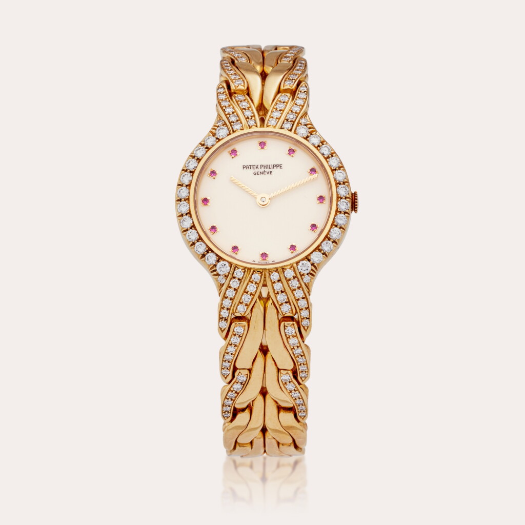View full screen - View 1 of Lot 346. Reference 4816/3 La Flamme | A yellow gold, ruby and diamond-set bracelet watch, Circa 1995.