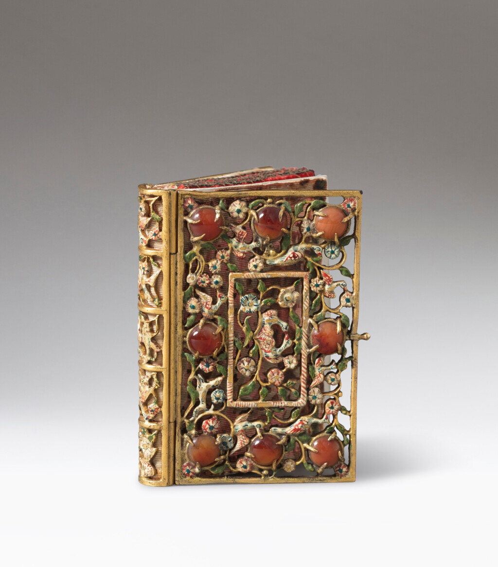 View full screen - View 1 of Lot 328. A small enameled silver-gilt book reliquary, probably Germany circa 1650 | Petit reliquaire en vermeil émaillé en forme de livre, probablement Allemagne vers 1650.