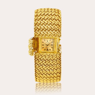 View full screen - View 1 of Lot 2103. Reference 2382 | A yellow gold bracelet watch with concealed dial, Circa 1960.