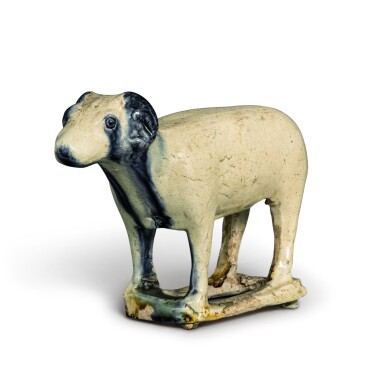 View full screen - View 1 of Lot 94. A rare blue-splashed pottery figure of a ram, Tang dynasty | 唐 白釉藍彩羊.