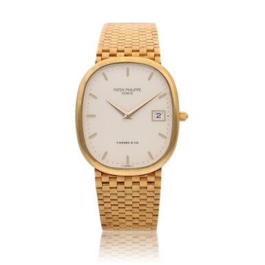 View full screen - View 1 of Lot 54. Reference 3747/1 'Jumbo' Ellipse, Retailed by Tiffany & Co.: A yellow gold bracelet watch, Circa 1985.