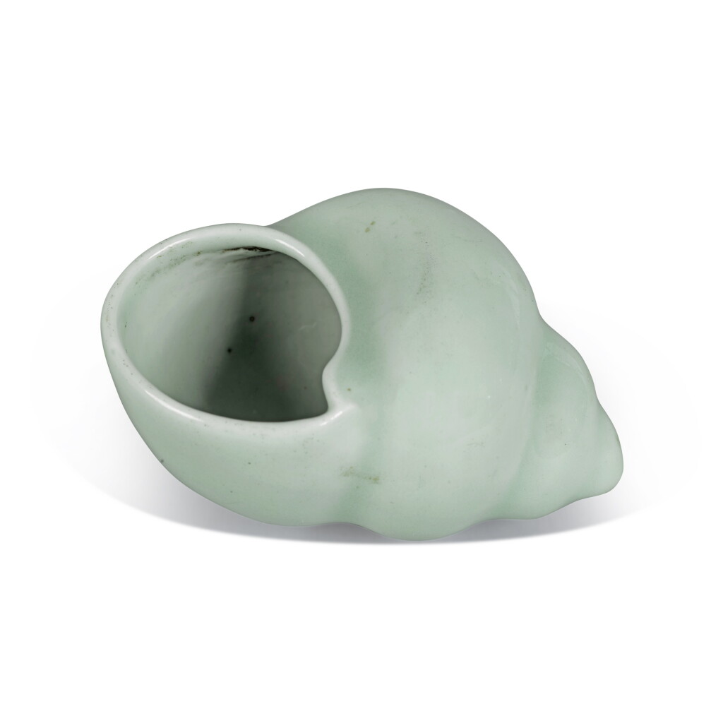 View full screen - View 1 of Lot 648. A celadon-glazed conch shell-form waterpot, Qing dynasty, 18th century | 清十八世紀 粉青釉海螺式水丞.