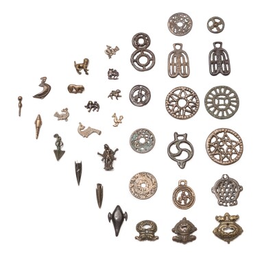 View full screen - View 1 of Lot 45. A study collection of thirty-four ornaments, Thokcha, Tibet and other Himalayan regions, 10th/14th century | 西藏及喜馬拉雅其他地區 十至十四世紀 托查一組三十四件.