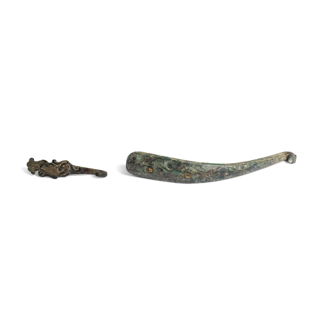View full screen - View 1 of Lot 548. A silver- and gold-inlaid bronze belt-hook, Eastern Zhou dynasty, Warring States period.