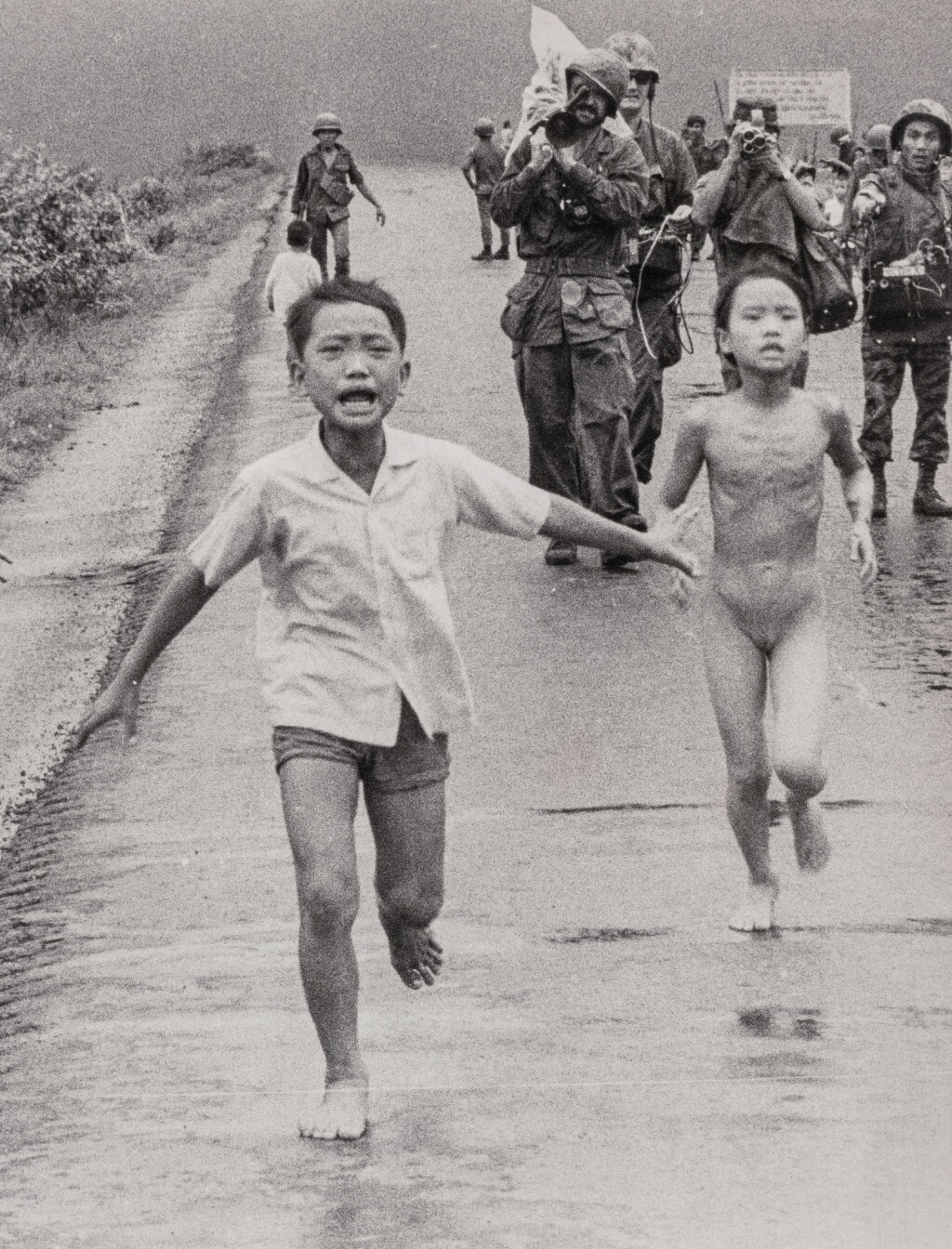 View full screen - View 1 of Lot 38. Untitled (South Vietnam, children run along Highway 1).
