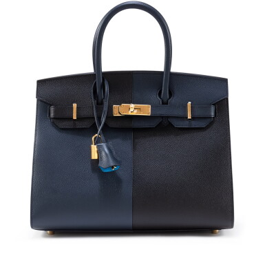View full screen - View 1 of Lot 634. Limited Edition Noir and Bleu Indigo Epsom Casaque Birkin 30 Sellier Gold Hardware, 2022.