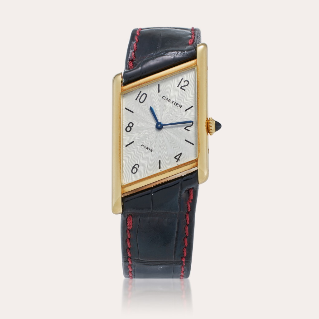 View full screen - View 1 of Lot 67. Reference 2488 Tank Asymétrique | A limited edition yellow gold asymmetrical wristwatch with Paris dial, Circa 1996.