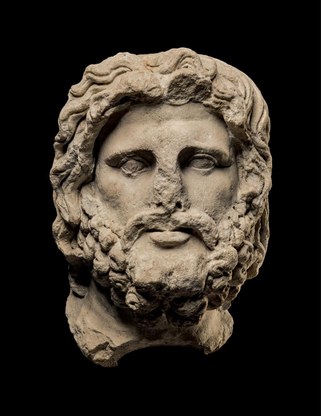 View full screen - View 1 of Lot 230. A ROMAN MARBLE HEAD OF SARAPIS, EASTERN MEDITERRANEAN, CIRCA 2ND CENTURY A.D..