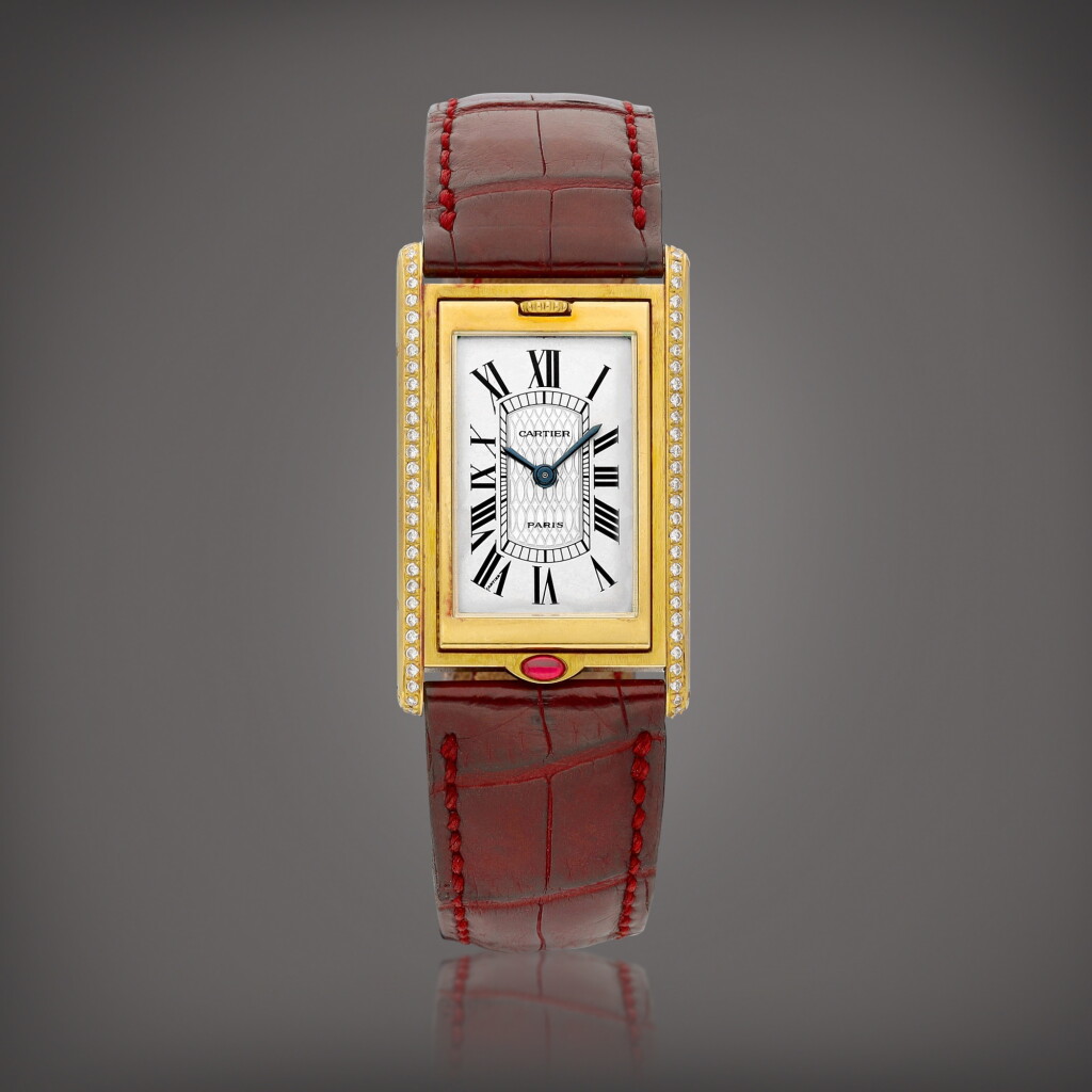 View full screen - View 1 of Lot 2211. Tank Basculante | A limited edition yellow gold, diamond and ruby-set reversible wristwatch, Made to commemorate the 150th anniversary of Cartier, Circa 1997 | 卡地亞 | Tank Basculante | 限量版黃金鑲鑽石及紅寶石可翻轉腕錶,為紀念品牌誕辰150週年而製,約1997年製.