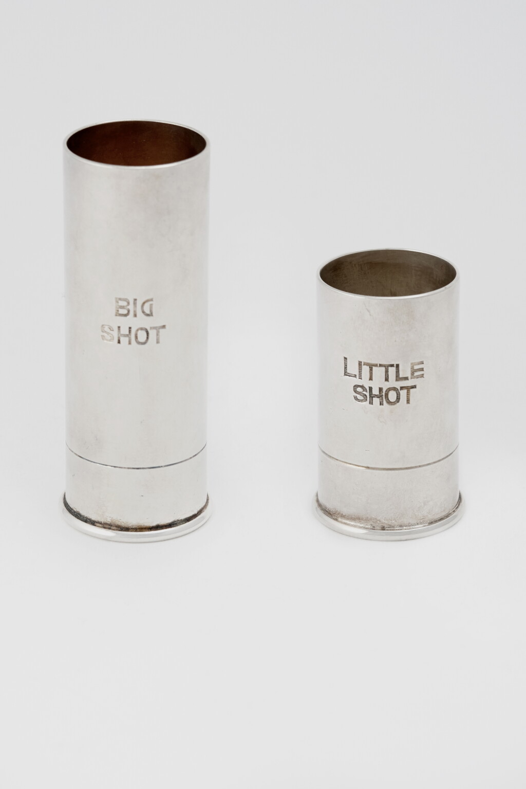 View full screen - View 1 of Lot 34. TWO ENGLISH SILVER-PLATED SPIRIT MEASURES.