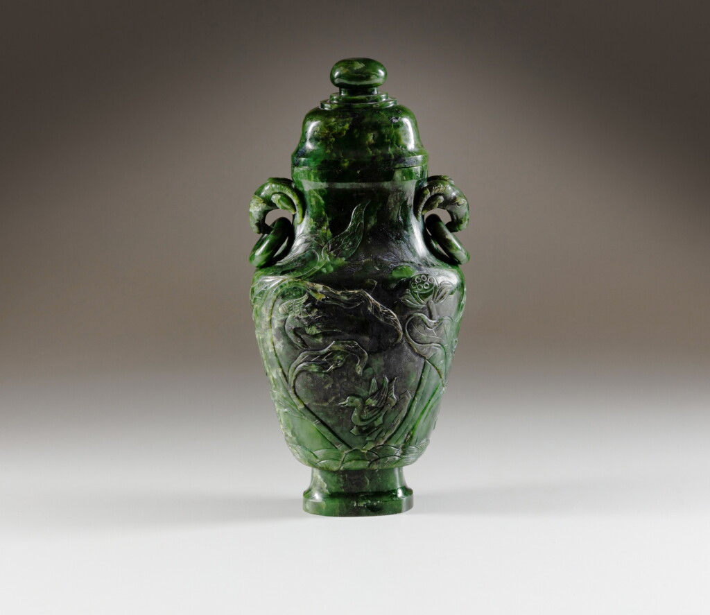 View full screen - View 1 of Lot 202. A large and impressive spinach jade ‘lotus pond’ vase and cover, Qing dynasty, 18th - 19th century | 清十八至十九世紀 碧玉荷塘鴛鴦雙羊活環耳蓋瓶.