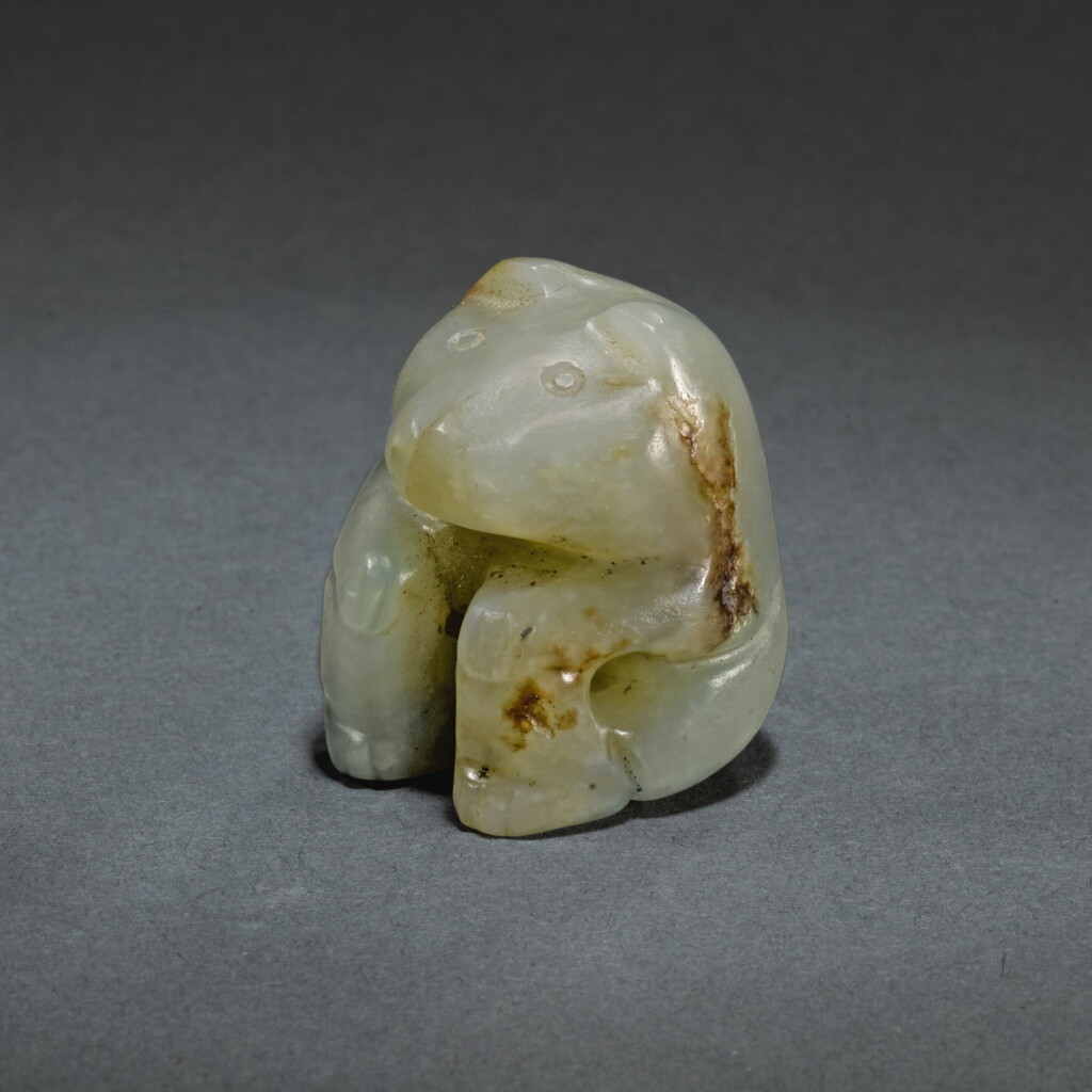 View full screen - View 1 of Lot 143. A RARE SMALL JADE FIGURE OF A BEAR, SHANG DYNASTY | 商 玉熊.