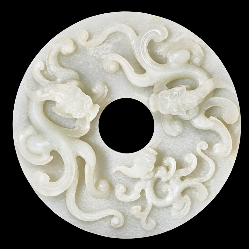 View full screen - View 1 of Lot 3602. A superbly carved white jade archaistic 'chilong' bi disc Qing dynasty, Qianlong period | 清乾隆 白玉螭龍紋璧.