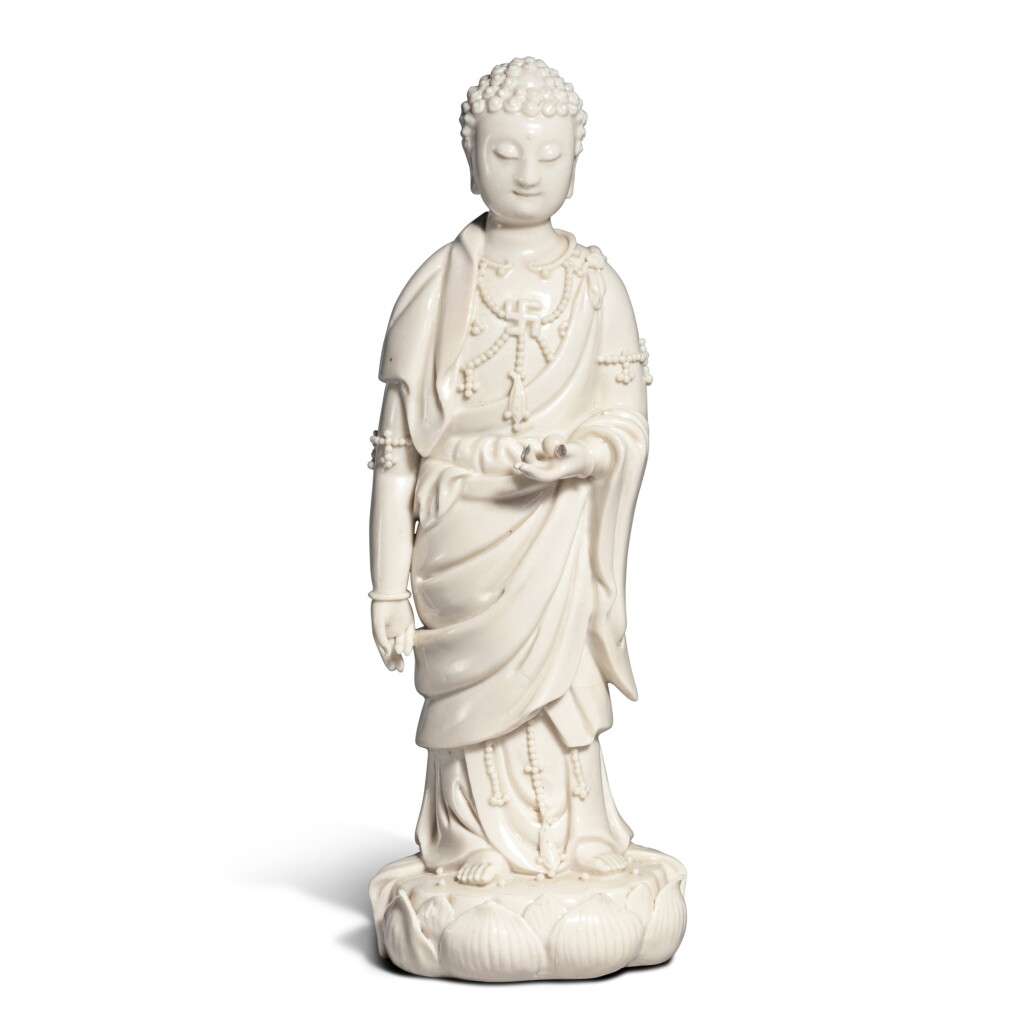 View full screen - View 1 of Lot 720. A 'Dehua' figure of Buddha, Qing dynasty, 19th century | 清十九世紀 德化白釉佛立像.
