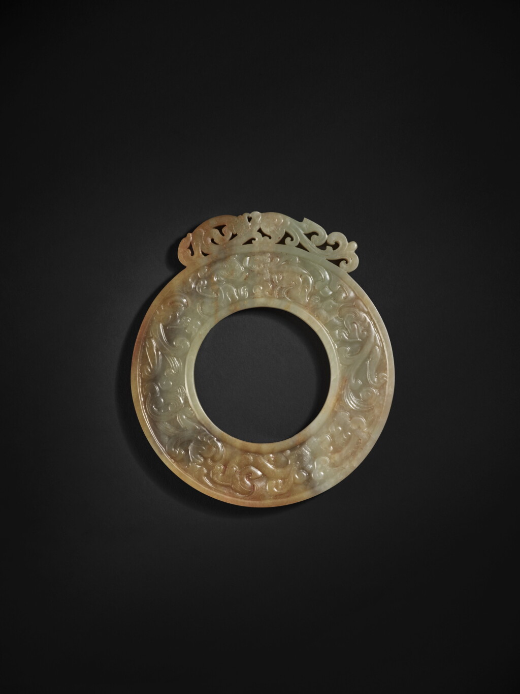 View full screen - View 1 of Lot 210. An extremely rare and important archaic green jade 'chilong' disc (Bi), Han dynasty | 漢 玉螭龍紋璧.