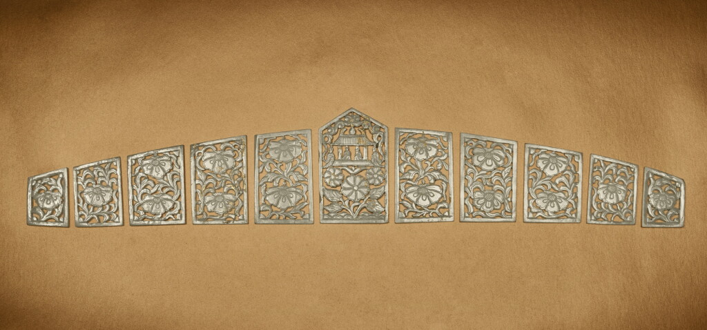 View full screen - View 1 of Lot 124. A set of eleven reticulated jade 'floral' belt plaques, Liao dynasty .