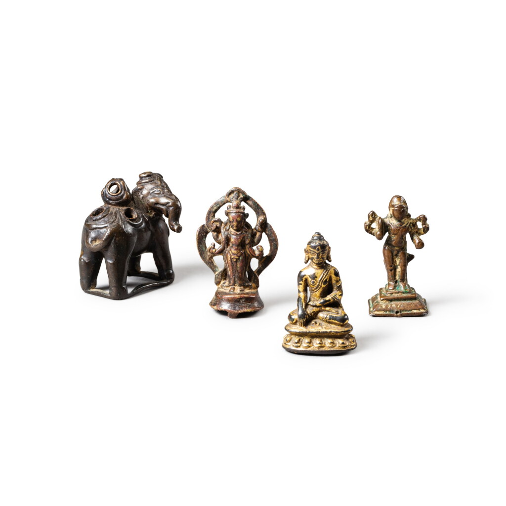 View full screen - View 1 of Lot 95. A group of four copper-alloy and gilt copper-alloy figures of deities Tibet, Nepal and South India, 12th-17th century | 西藏、尼泊爾及印度南 十二至十七世紀 合金銅及鎏金銅合金佛像一組四尊.