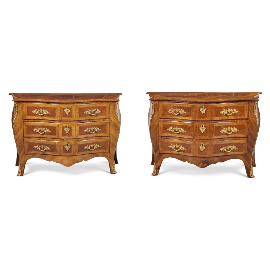 View full screen - View 1 of Lot 211. A Pair of George III Gilt Brass Mounted Padouk and Sabicu Commodes, one Circa 1765, the other a later copy.