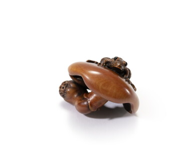 View full screen - View 1 of Lot 194. A carved wood study of a toad sitting atop a mushroom, Nagoya School, 19th century | 日本 名古屋 十九世紀 木雕蟾蜍根付.