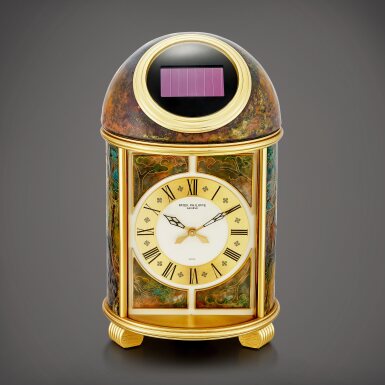 View full screen - View 1 of Lot 2269. "Une page d'Histoire", Reference 1350M | A unique gilt brass solar powered dome table clock with cloisonné enamel, Made in 1990 | 百達翡麗 | "Une page d'Histoire" 型號1350M | 獨一無二鍍金銅製太陽能座鐘,備掐絲琺瑯,1990年製.