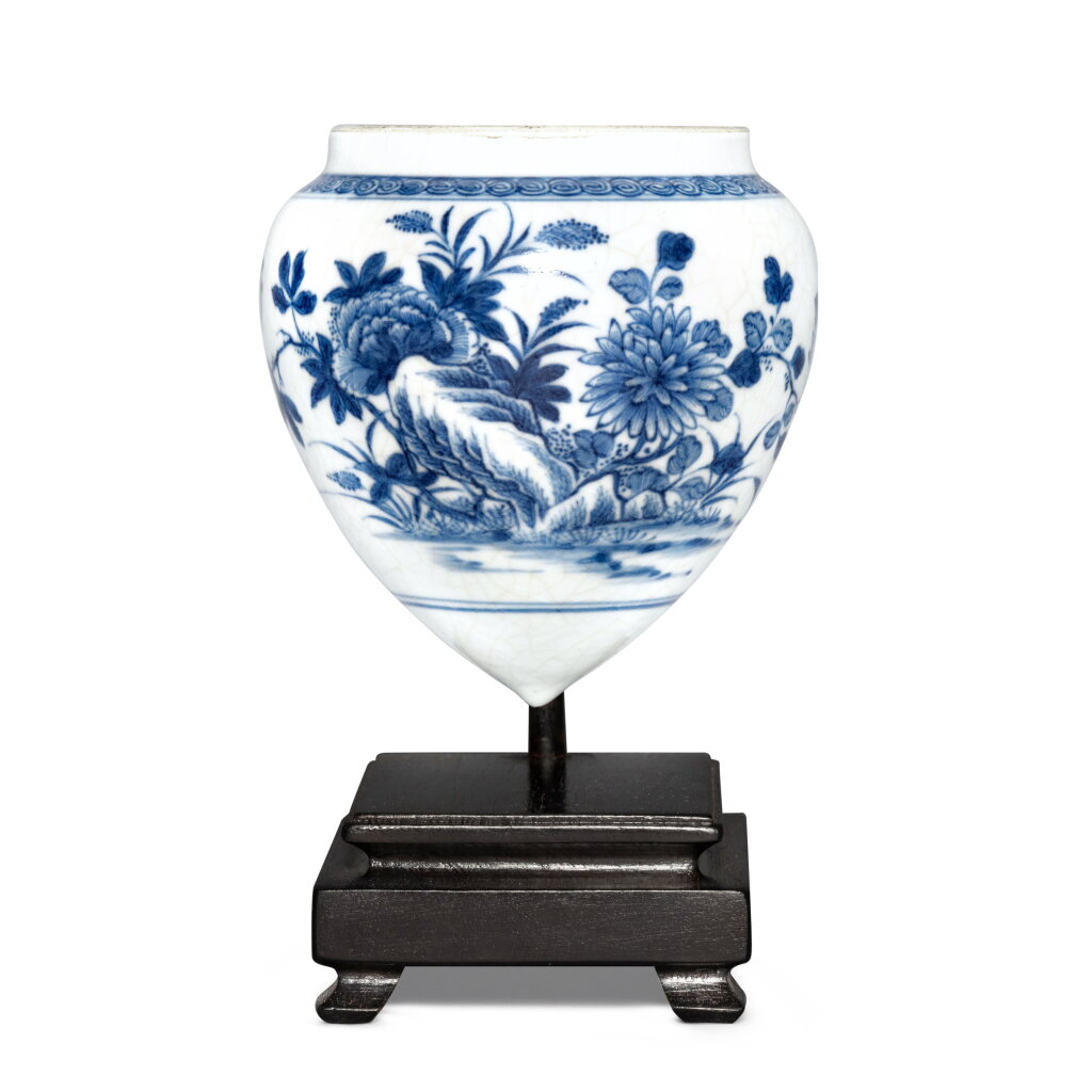 View full screen - View 1 of Lot 7. A blue and white soft-paste 'floral' bird feeder, Qing dynasty, 18th century.