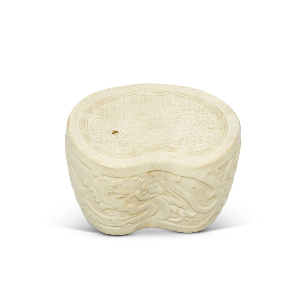 View full screen - View 1 of Lot 203. A rare molded Qingbai 'boy and dragon' pillow, Northern Song dynasty.