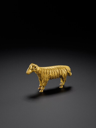 View full screen - View 1 of Lot 120. A gilt-bronze figure of a ram, Ming dynasty, 15th century | 明十五世紀 鎏金銅立羊.