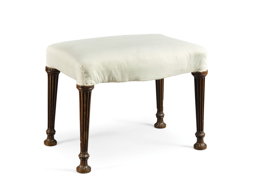 View full screen - View 1 of Lot 249. A George III serpentine mahogany stool by Thomas Chippendale, 1772.