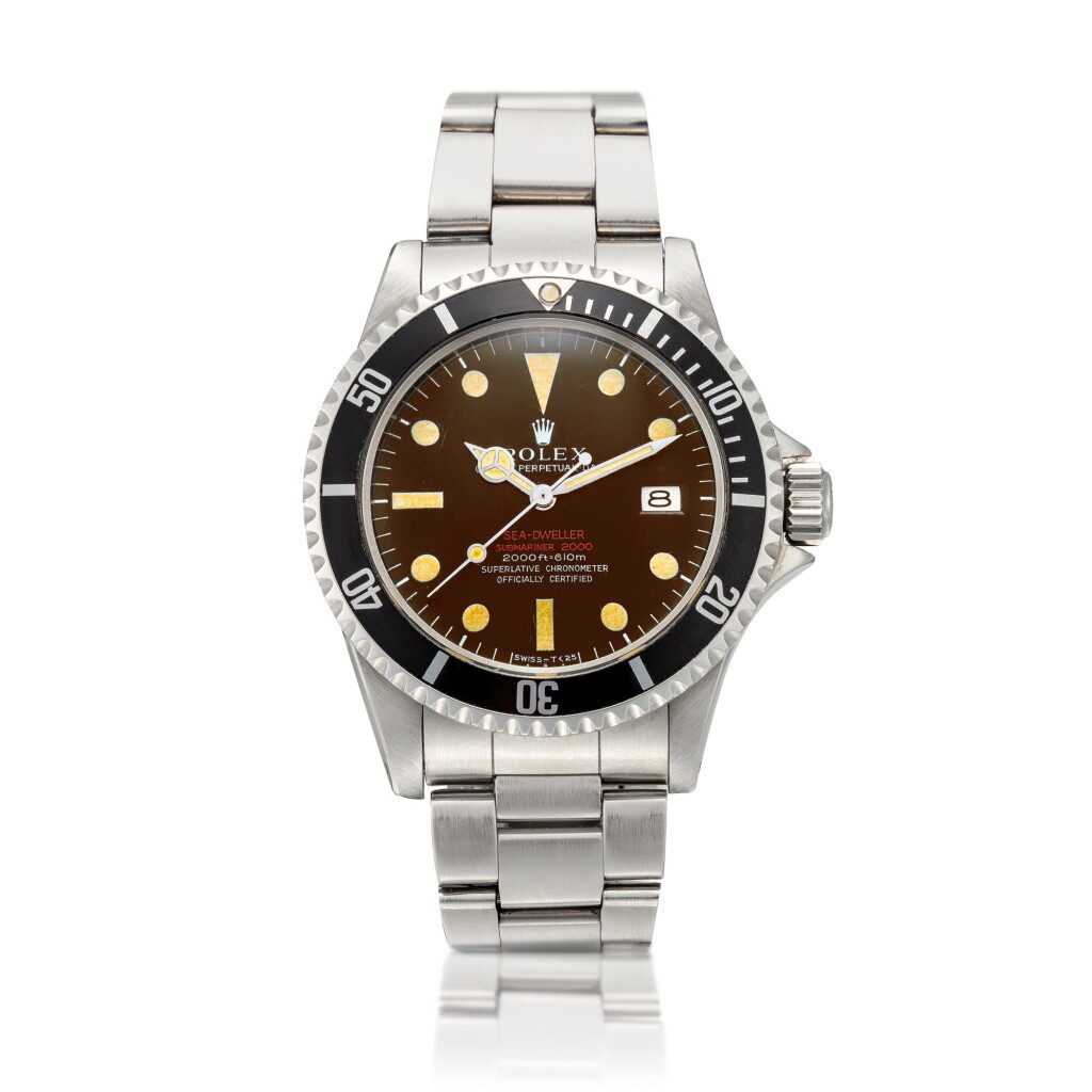 View full screen - View 1 of Lot 37. 'Double Red' Sea-Dweller, Ref. 1665 Stainless steel wristwatch with date, 'tropical' dial, thin case and bracelet Circa 1967 | 勞力士1665型號「'Double Red' Sea-Dweller」精鋼鍊帶腕錶備日期顯示及熱帶錶盤,年份約1967.