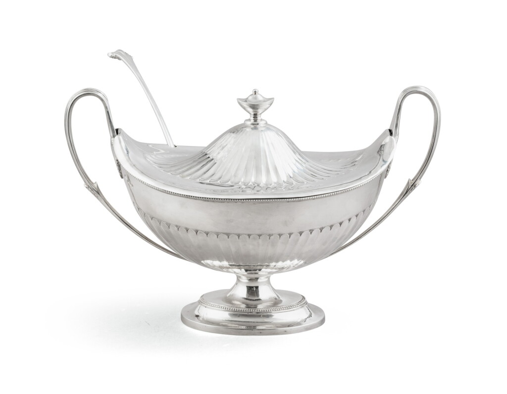 View full screen - View 1 of Lot 23. An English silver oval covered tureen with ladle, Sotirio Bulgari, London, 1993, in fitted Bulgari case | Soupière ovale couverte et sa louche en argent par Sotirio Bulgari, Londres, 1993, dans son écrin Bulgari.