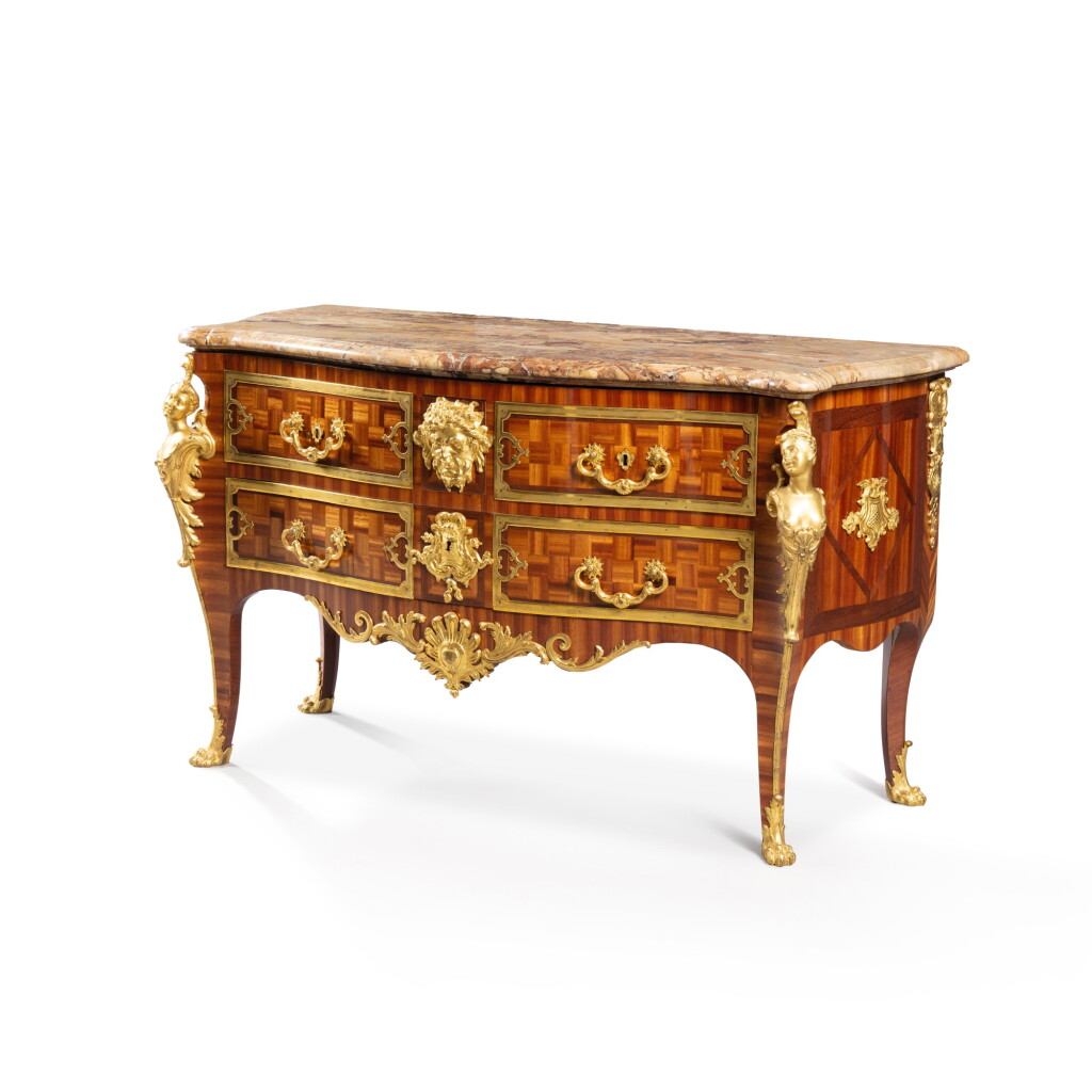 View full screen - View 1 of Lot 360. A Louis XV "espagnolettes" gilt-bronze mounted, satiné and amaranth commode, by Charles Cressent, circa 1730 | Commode "aux espagnolettes" en placage de bois de satiné et amarante, monture de bronze doré d'époque Louis XV, par Charles Cressent, vers 1730 .