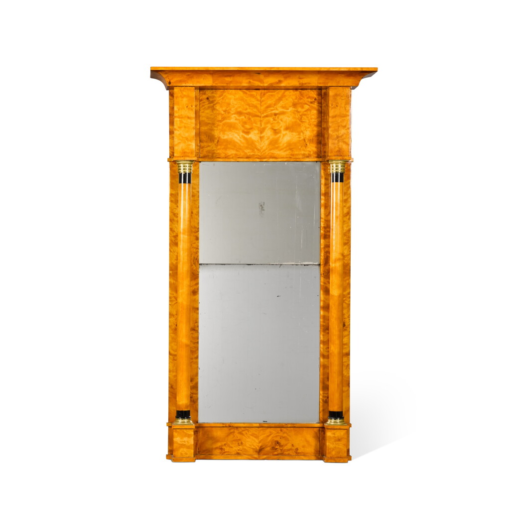 View full screen - View 1 of Lot 701. A Biedermeier gilt-bronze mounted, ebonised and birch pier mirror, second quarter 19th century.