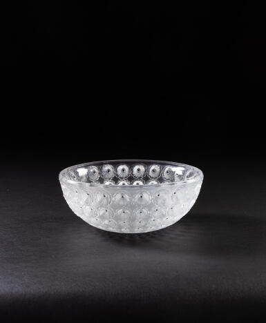 View full screen - View 1 of Lot 264. A pressed white glass and black enamel fruit bowl, Lalique France, the model created in 1929.