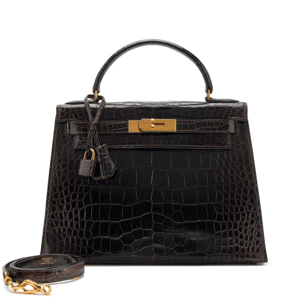 View full screen - View 1 of Lot 146. Vintage Marron Fonce Shiny Porosus Crocodile Sellier Kelly 28 Gold Hardware, 1986.