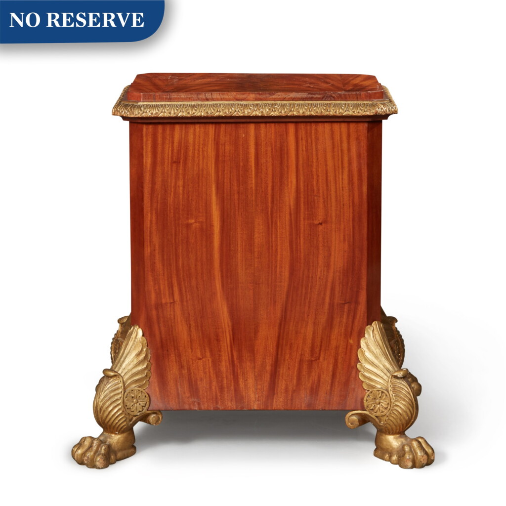 View full screen - View 1 of Lot 255. A Continental Neoclassical Mahogany and Parcel Gilt Pedestal, Early 19th Century.