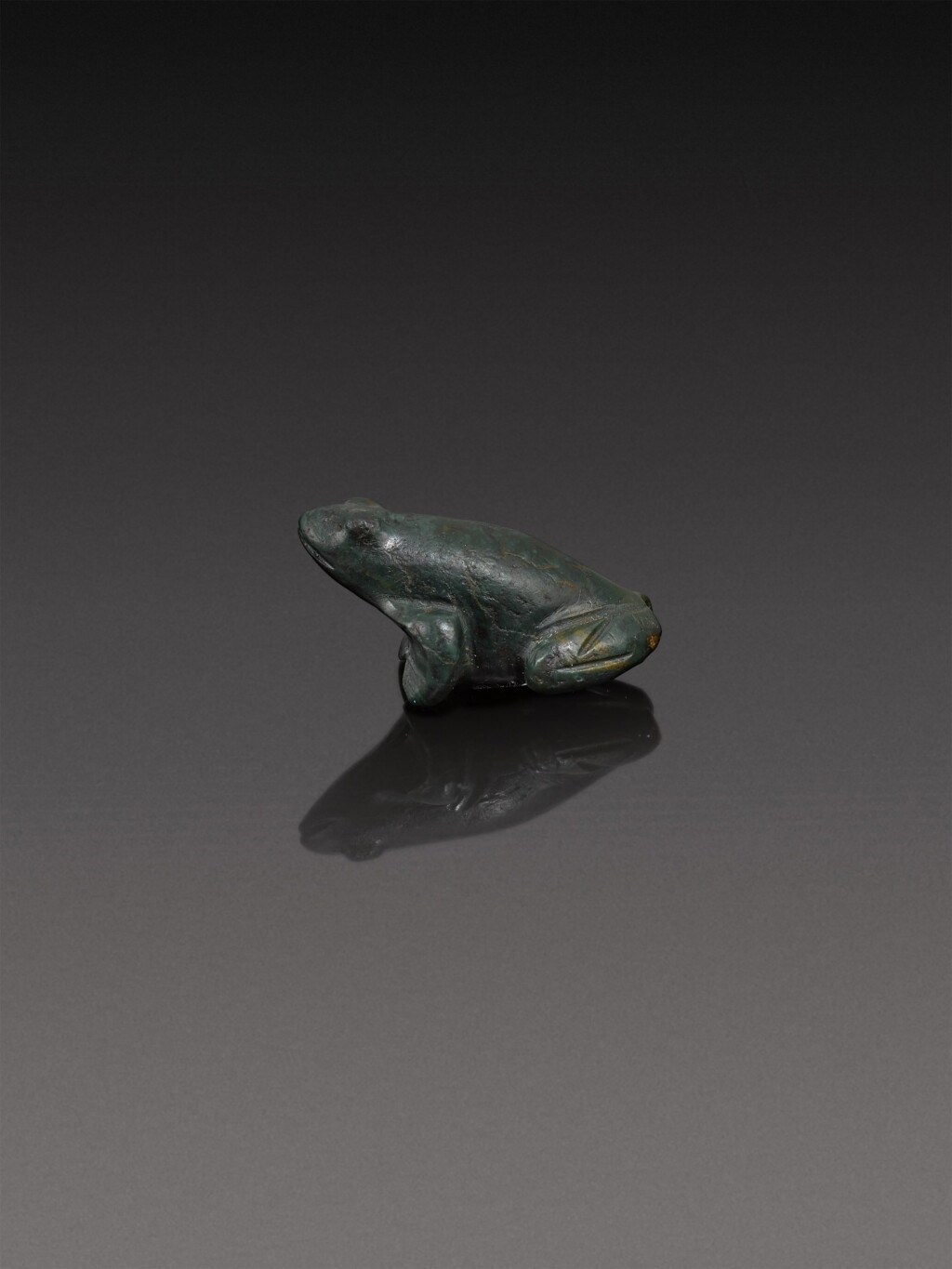 View full screen - View 1 of Lot 147. An Egyptian Stone Figure of a Frog, 26th/30th Dynasty, 664-342 B.C..