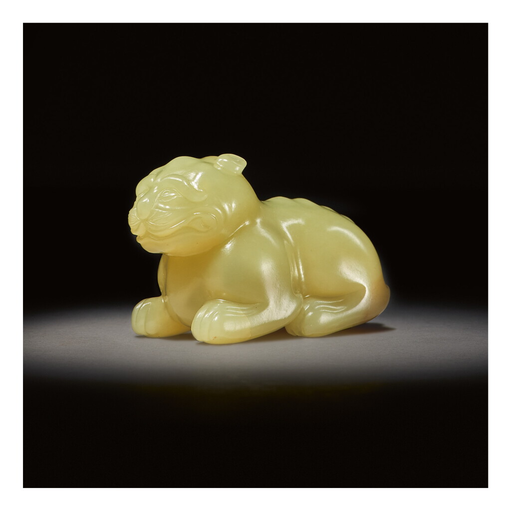 View full screen - View 1 of Lot 254. A RARE YELLOW JADE CARVING OF A MYTHICAL BEAST, SONG - MING DYNASTY.