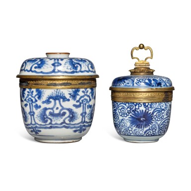View full screen - View 1 of Lot 651. Two blue and white and gilt-metal-mounted jars and covers, Qing dynasty, Kangxi period | 清康熙 青花蓋罐一組兩件.