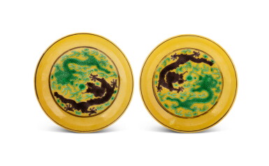 View full screen - View 1 of Lot 171. A pair of yellow-ground green and aubergine enameled 'dragon' saucers Marks and period of Guangxu | 清光緒 黃地紫綠彩雙龍戲珠紋小盤一對 《大清光緒年製》款.